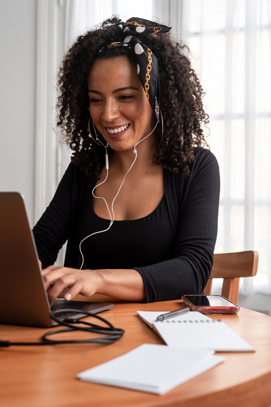 Happy Woman Working at Home with Laptop